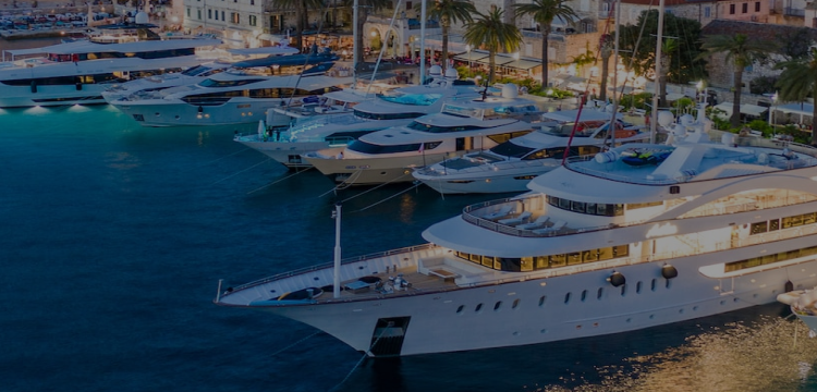 Clients are discussing the purchase of yachts for sale parked in Dubai Marina