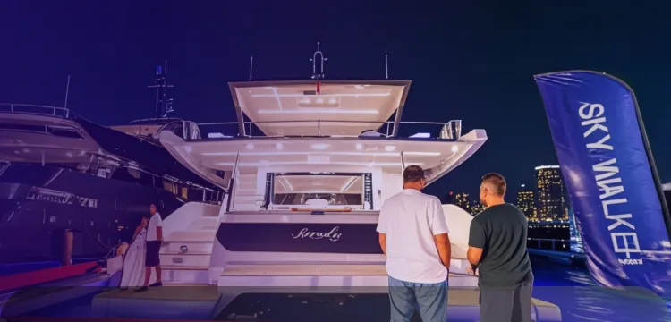 Clients are discussing the purchase of yachts for sale parked in Dubai Marina