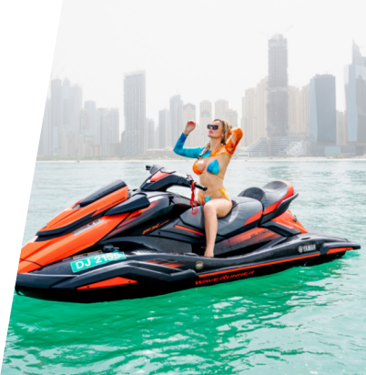 A beautiful woman poses in a jet ski parked on the waters of Dubai.
