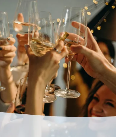 corporate personnel raise a glass to celebrate